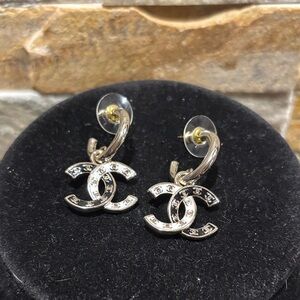 Elegant black, white and gold designer logo earrings added